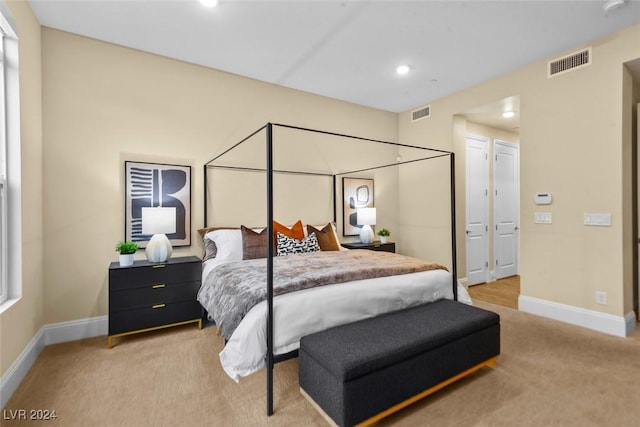 bedroom featuring recessed lighting, baseboards, visible vents, and light colored carpet