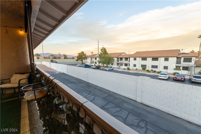 view of balcony at dusk