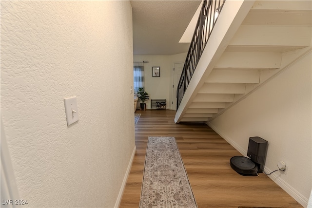 corridor featuring hardwood / wood-style flooring