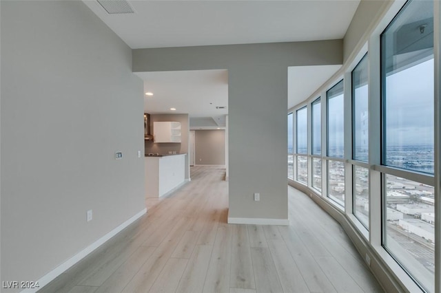 4525 Dean Martin Dr Unit 2704, Las Vegas, NV 89103 - unfurnished room with light wood-style floors and baseboards