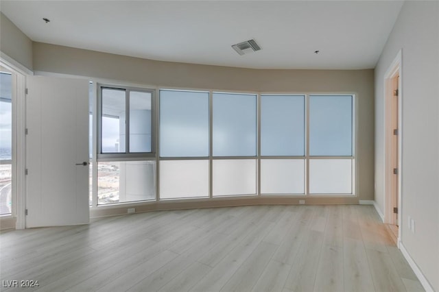 4525 Dean Martin Dr Unit 2704, Las Vegas, NV 89103 - spare room featuring light wood-style floors and baseboards