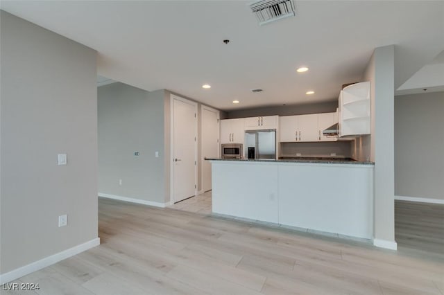 4525 Dean Martin Dr Unit 2704, Las Vegas, NV 89103 - kitchen featuring stainless steel appliances, open shelves, dark countertops, baseboards, and recessed lighting