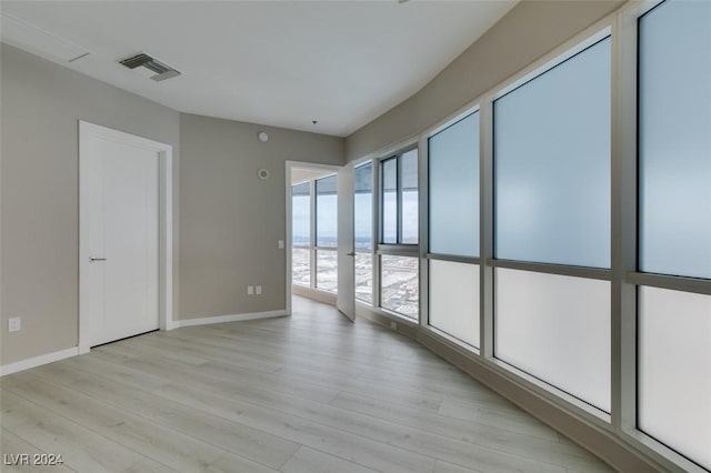 4525 Dean Martin Dr Unit 2704, Las Vegas, NV 89103 - empty room with light wood finished floors and baseboards