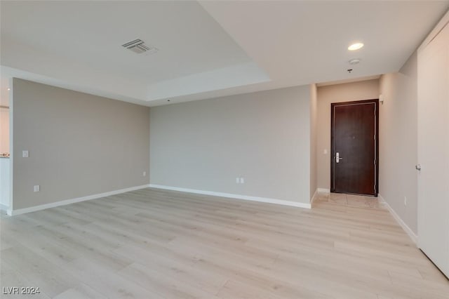 4525 Dean Martin Dr Unit 2704, Las Vegas, NV 89103 - unfurnished room with light wood finished floors, baseboards, recessed lighting, and a raised ceiling