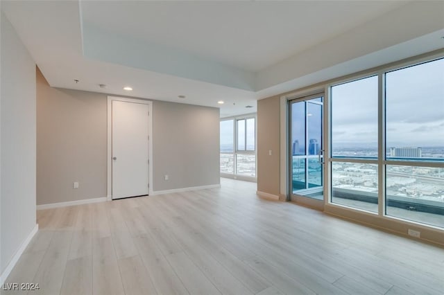 4525 Dean Martin Dr Unit 2704, Las Vegas, NV 89103 - unfurnished room with light wood-style flooring, baseboards, and recessed lighting
