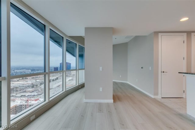 4525 Dean Martin Dr Unit 2704, Las Vegas, NV 89103 - empty room with light wood-style flooring, baseboards, and recessed lighting