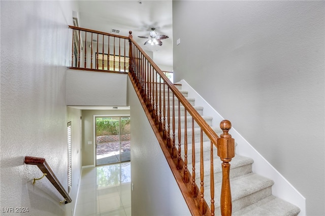 stairs with ceiling fan