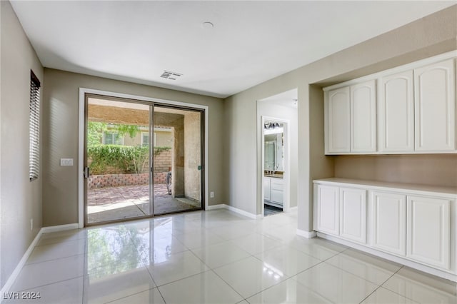 interior space featuring light tile patterned flooring