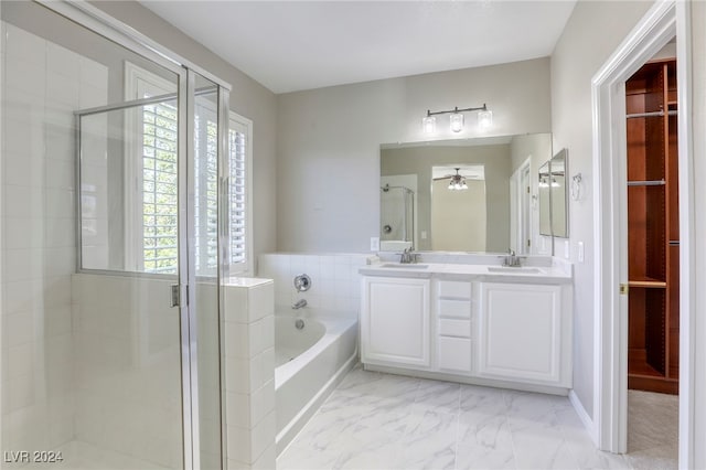 bathroom featuring vanity, shower with separate bathtub, and ceiling fan