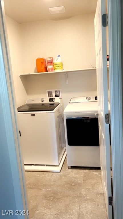 clothes washing area featuring washing machine and dryer