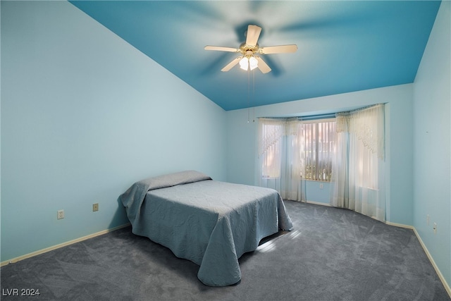 bedroom featuring ceiling fan, dark colored carpet, and vaulted ceiling