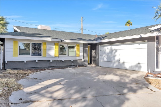 ranch-style house featuring a garage