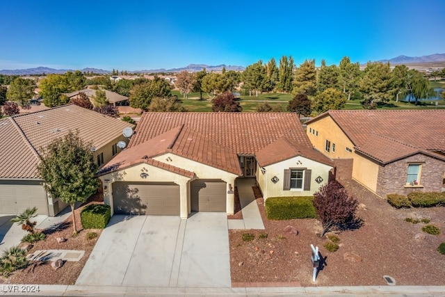 birds eye view of property with a mountain view