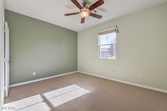 unfurnished room with light carpet and ceiling fan