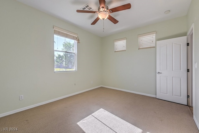 carpeted empty room with ceiling fan