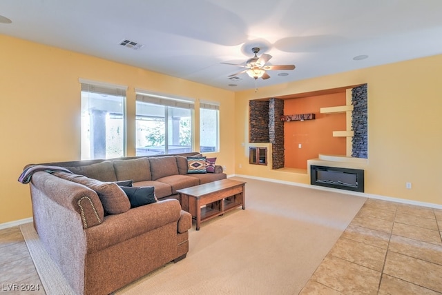 tiled living room featuring ceiling fan