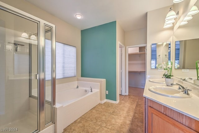 bathroom with vanity, tile patterned floors, and separate shower and tub