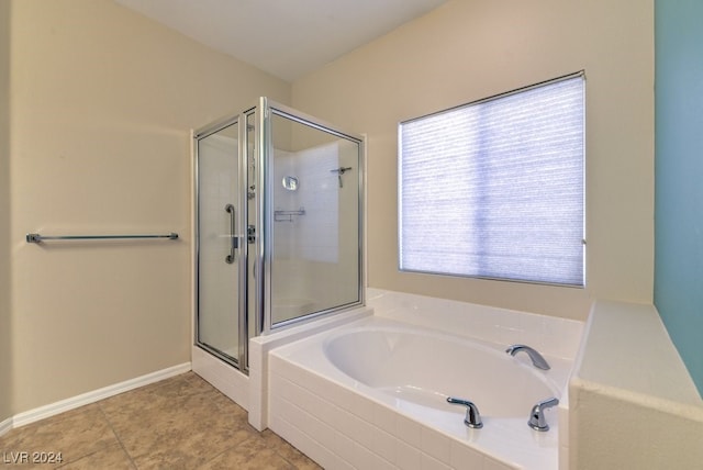 bathroom with tile patterned floors and shower with separate bathtub