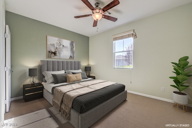 bedroom featuring ceiling fan and carpet