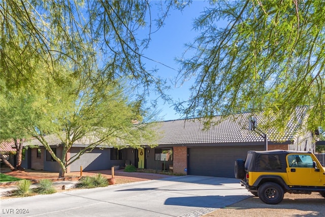 ranch-style house featuring a garage