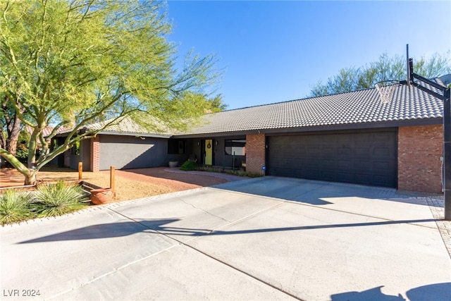 ranch-style home with a garage