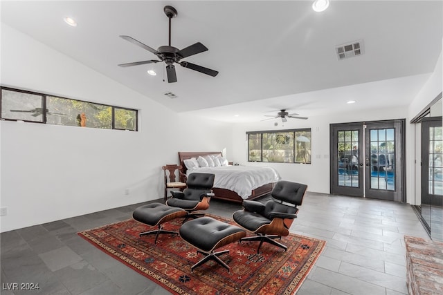 tiled bedroom with multiple windows, ceiling fan, and access to exterior