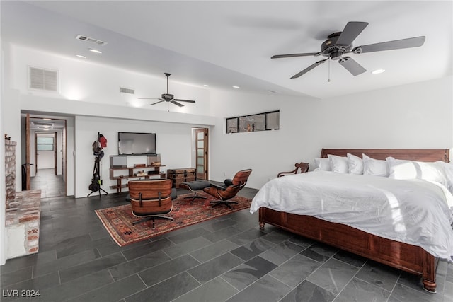 bedroom with ceiling fan and lofted ceiling