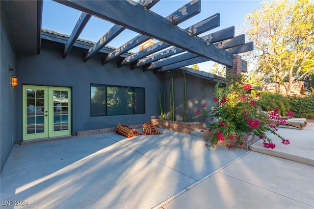 view of patio featuring a pergola and french doors