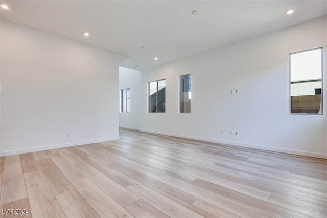 spare room featuring light wood-type flooring