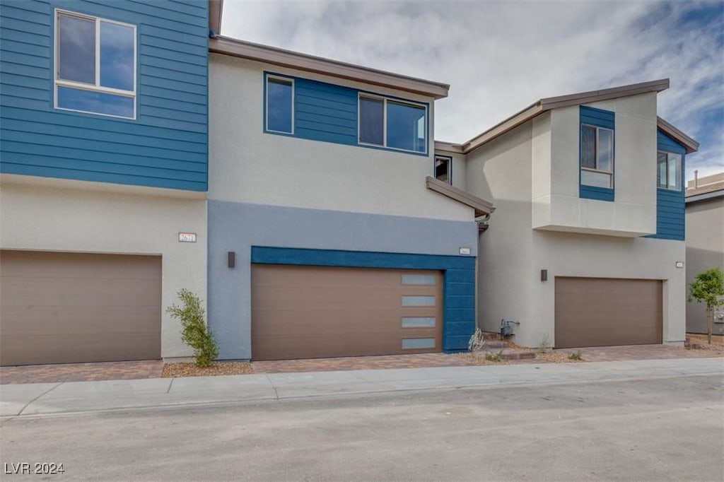 view of front of property with a garage