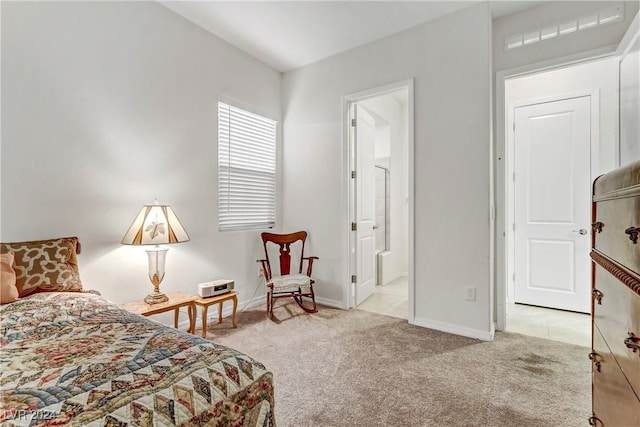 carpeted bedroom featuring connected bathroom