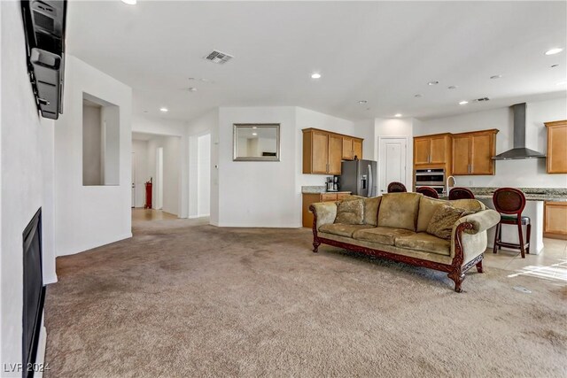 carpeted living room featuring sink