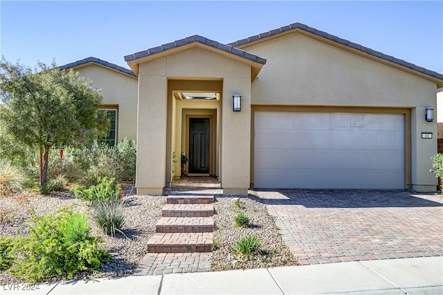 view of front of home with a garage