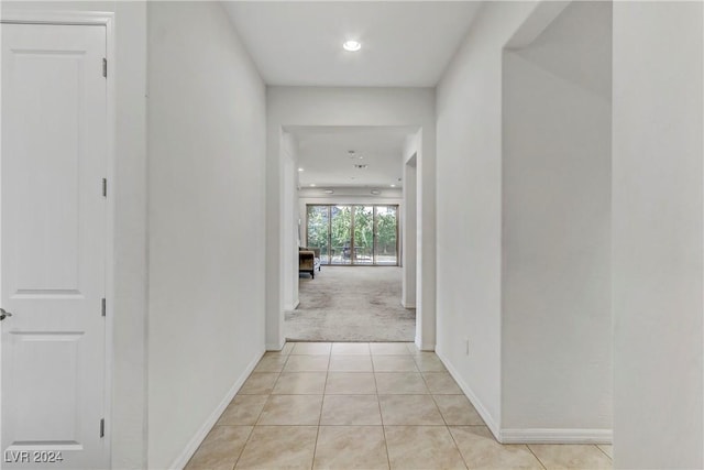 corridor with light tile patterned floors