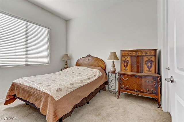 bedroom with light colored carpet