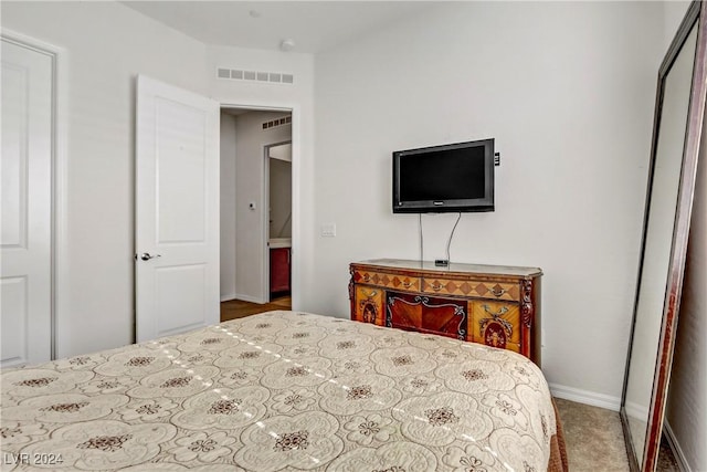 bedroom featuring visible vents and baseboards