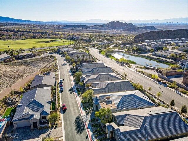 bird's eye view featuring a water and mountain view