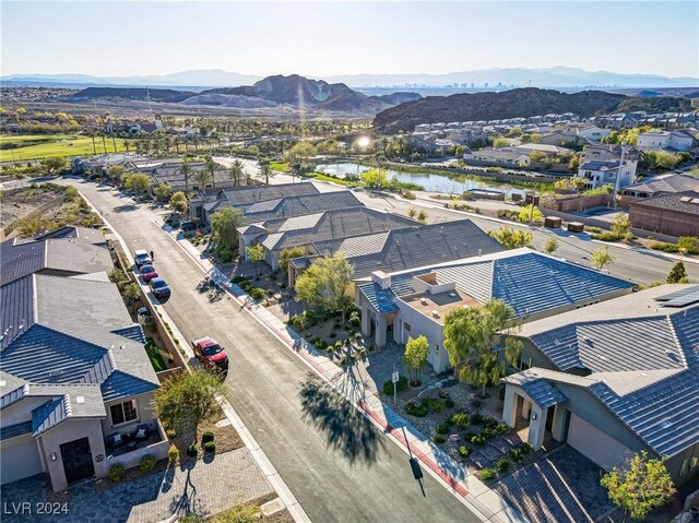 aerial view featuring a water and mountain view