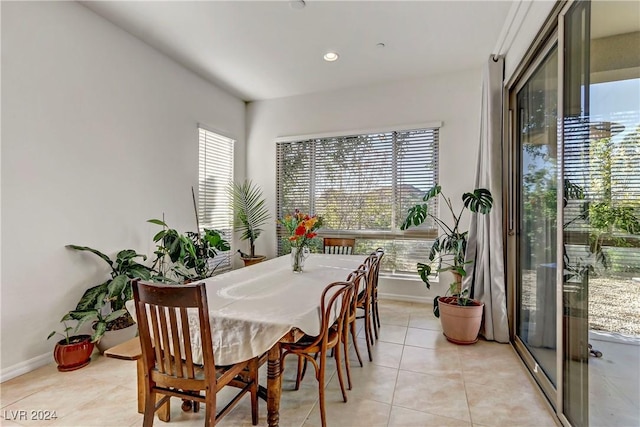 dining area featuring recessed lighting, baseboards, and light tile patterned flooring