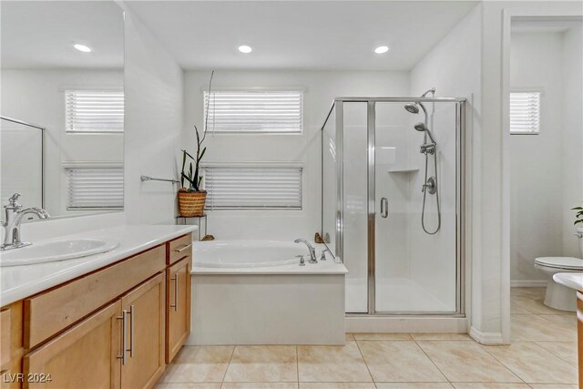 full bathroom featuring a bidet, separate shower and tub, vanity, tile patterned floors, and toilet