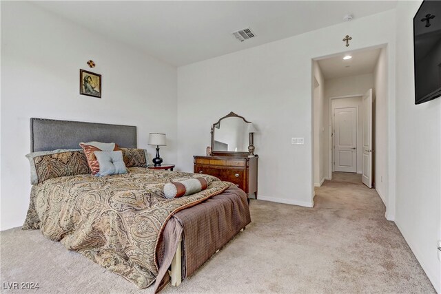 bedroom with light carpet