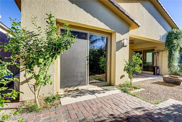 property entrance with a patio area