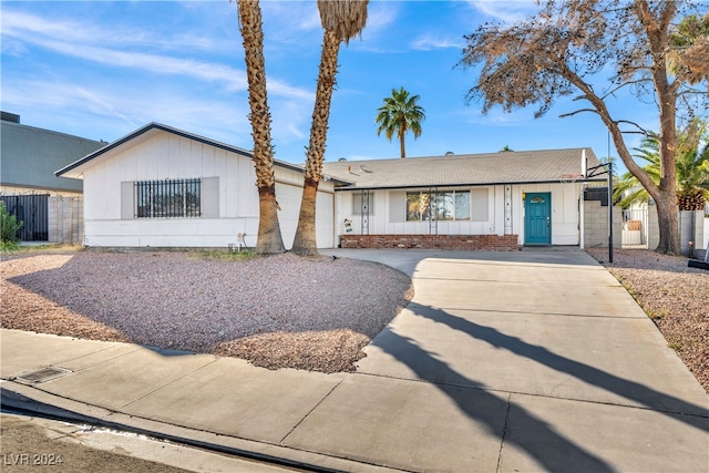 ranch-style home featuring a garage