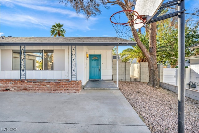 view of exterior entry with a porch