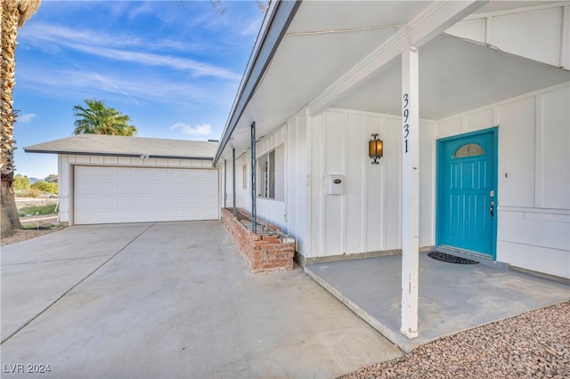 doorway to property featuring a garage