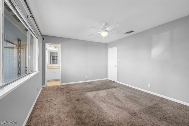 spare room featuring carpet flooring and ceiling fan