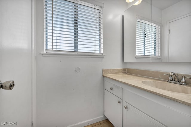 bathroom with vanity and tile patterned flooring