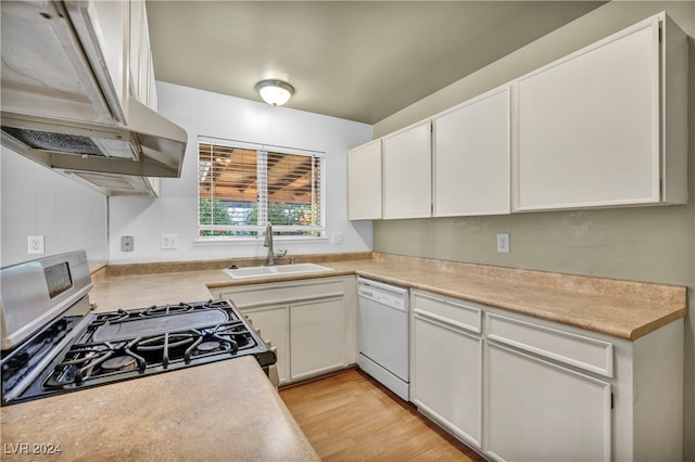 kitchen with range hood, white cabinetry, sink, dishwasher, and stainless steel range with gas stovetop