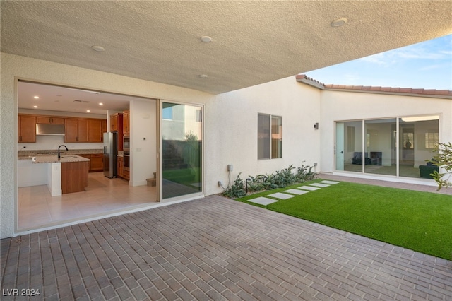 view of patio / terrace featuring exterior kitchen