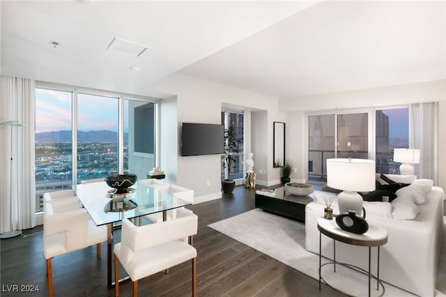 living room featuring baseboards and dark wood-style floors